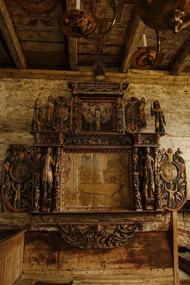Carved and painted altarpiece inside Kvernes Stave Church