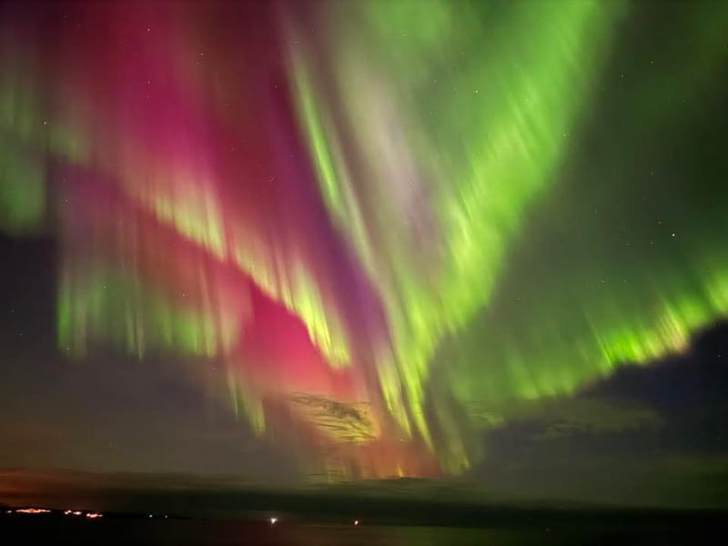 Northern lights across the horizon