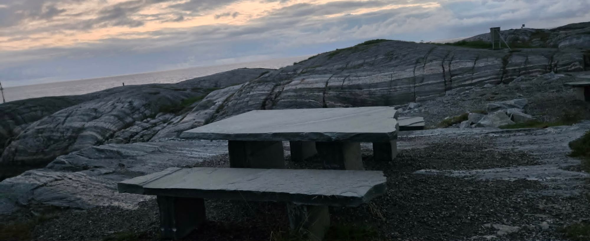 Stone benches overlooking the sea at Klubba
